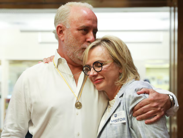 Charla Aldous and firm client Brendan Higgans, May 2022. Photo courtesy of The Dallas Morning News. Used with permission.
